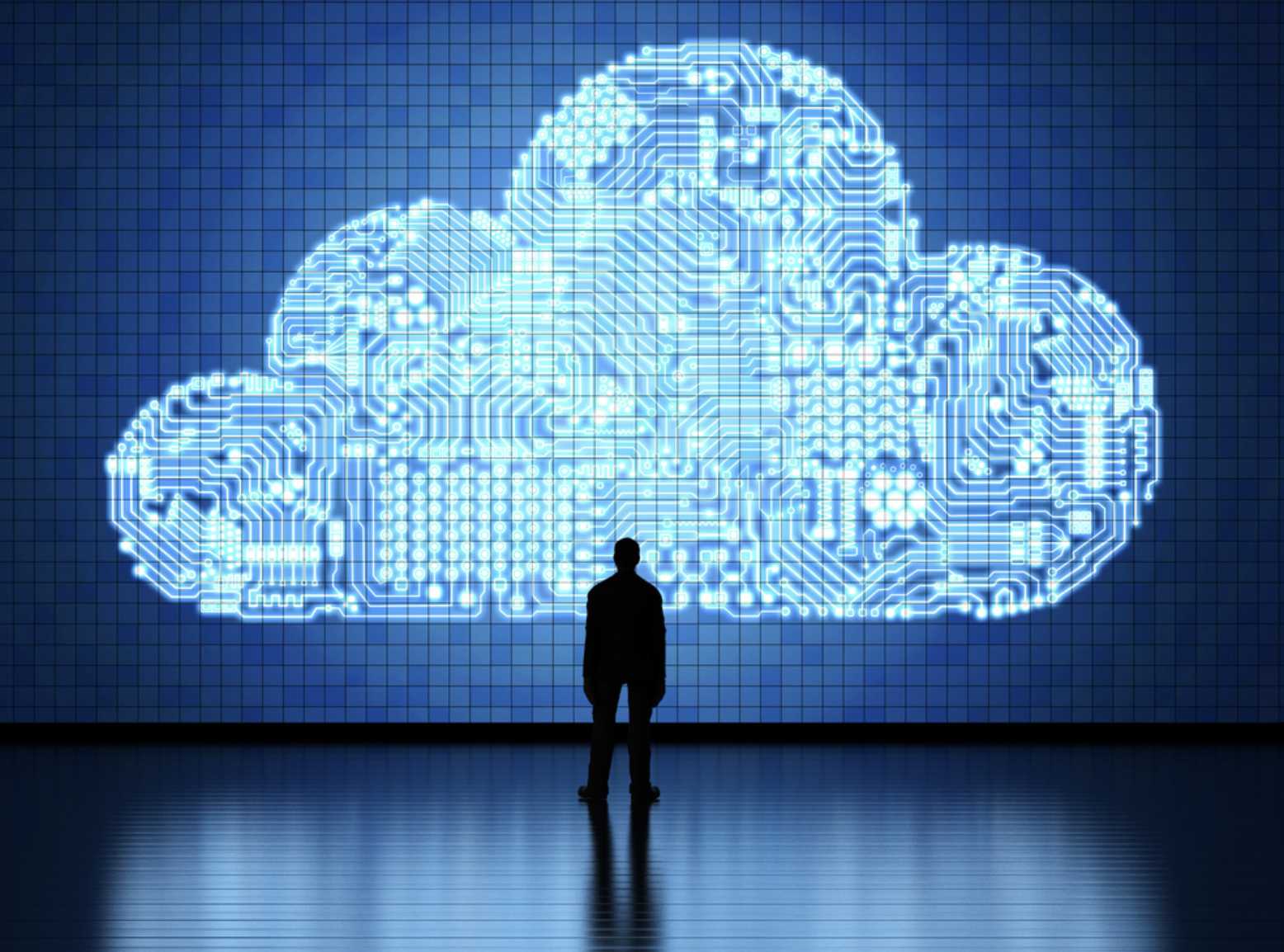  Cloud Computing. A man looking at a digital cloud.