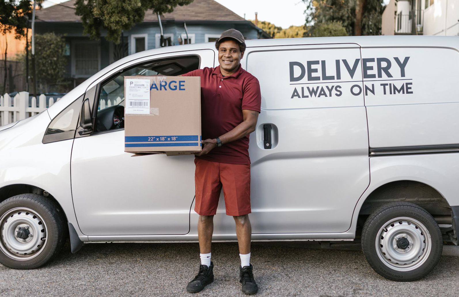 Delivery software. A man delivering a parcel.